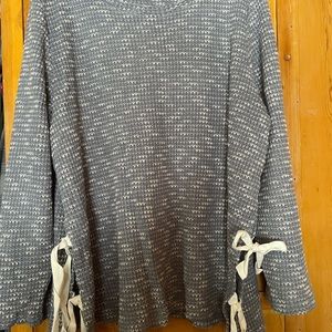 Waffle knit type sweater with ties on the side